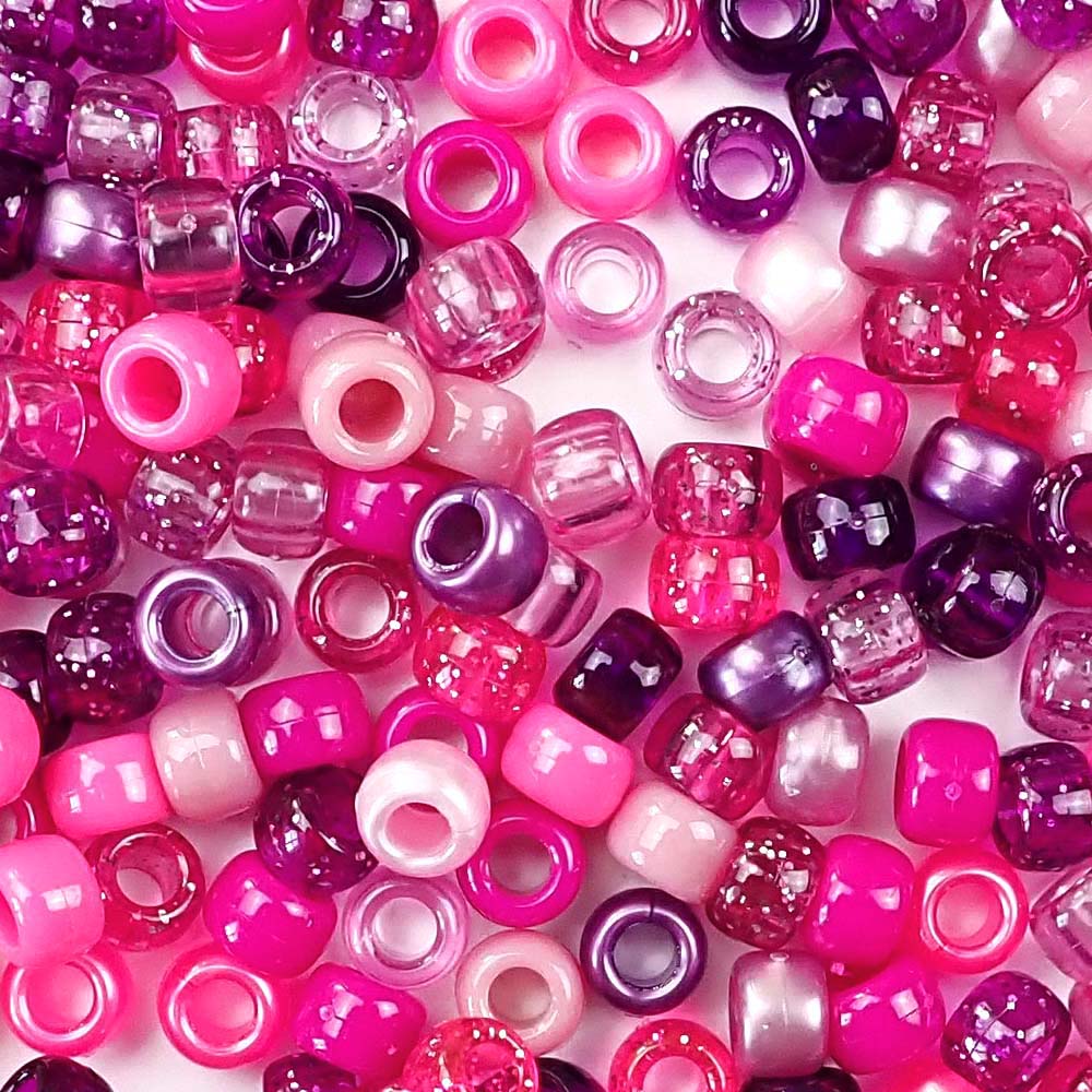 mixed colors of pony beads in different shades of pink and purple