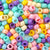 mixed colors of pony beads in a pastel color scheme