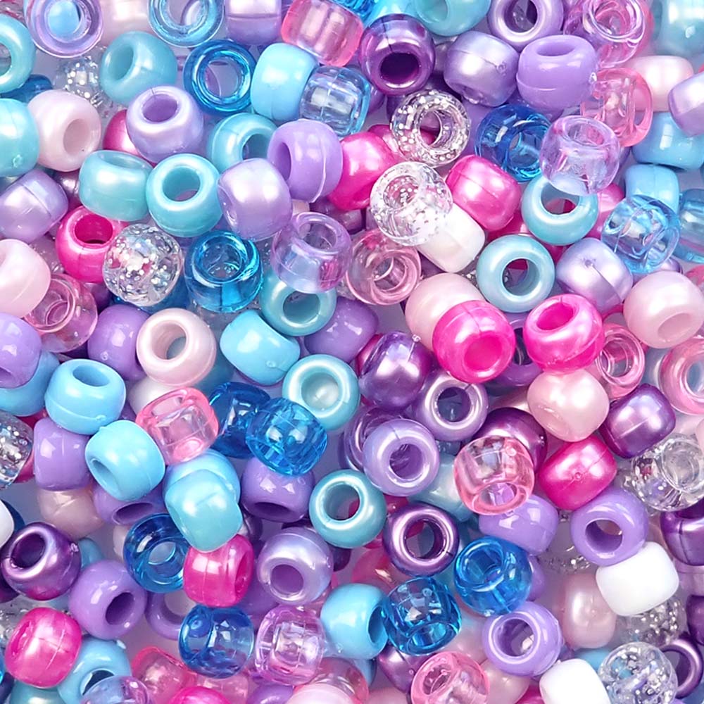mixed colors of pony beads in a princess color inspired mix of pinks, blues and purple colors