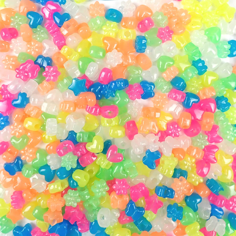 plastic crafts beads in a mix of shapes and glow colors